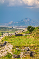 Fototapeta na wymiar The walls of The Fortress Rozafa with mountain range on background, Shkoder town, Albania, Europe.