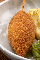 Chicken Kiev cutlets with parsley leaves. Ukrainian tradition food. Chicken Kiev, ukrainian cuisine. Chicken cutlet in bread crumbs stuffed with butter and herbs, served with mashed potato. Close up