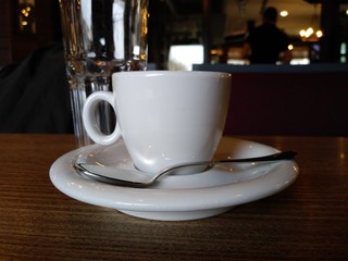 cup of coffee on wooden table