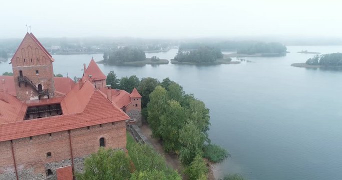 Trakai, Lithuania: medieval gothic Island castle, located in Galve lake and town in the background. Aerial above summer UAV top view, flat lay of the most beautiful Lithuanian landmark.