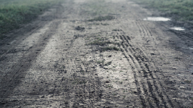 High Angle View Of Tire Track On Dirt Road