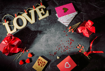 Valentine's Day background: gift box, chocolate sweets on dark background. Valentine's day greeting card