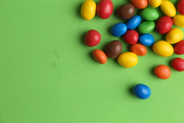 Obraz premium delicious colorful chocolate balls stuffed with peanut