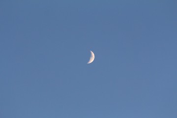 Crescent moon in the skies, wide shot