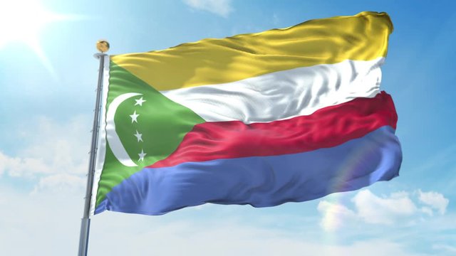 Comoros flag waving in the wind against deep blue sky. National theme, international concept. 3D Render Seamless Loop 4K