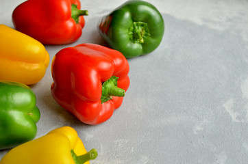 Multi-colored organic fresh sweet bell peppers. Green, red and yellow vegetables. Healthy food concept. Copy space.