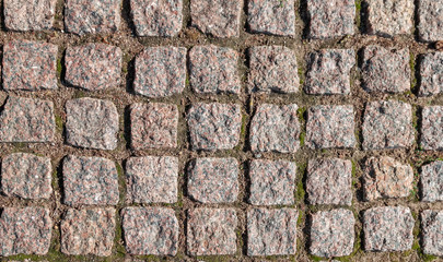 Mosaic pattern of irregular coarse granite stones. floor, texture of pavement