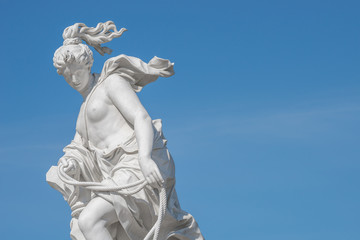 Old statue of a sensual naked Renaissance Era woman in the park of Potsdam, Germany, details, closeup