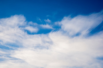 White clouds against the blue sky.