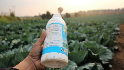 Pesticide bottle handle