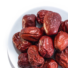 Large dates on a white isolated background. Plum and dried fruit food for your website design. kitchen theme