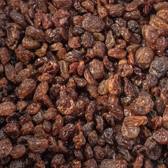Raisins peeled on a white isolated background. Food grape  brown delicious for your design for the site. kitchen theme