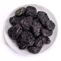 Prunes on a white isolated background. Food for your website design. kitchen theme cuisine and cooking