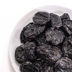 Prunes on a white isolated background. Food for your website design. kitchen theme cuisine and cooking