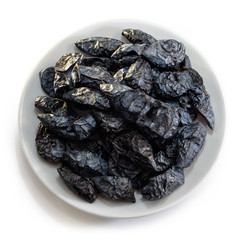 Prunes on a white isolated background. Food for your website design. kitchen theme cuisine and cooking