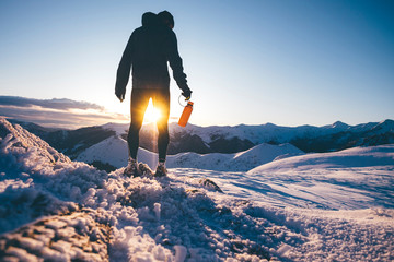Man hiking in the mountains in winter