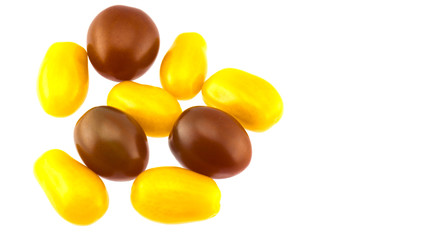 Colorful cherry tomatoes on a white background