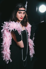 vintage Gatsby 20s fashion style ,make up and hairstyle. Soft Selective focus of model young woman,...