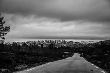 Traveling around Norway by car. Mountains, fjeds and roads.