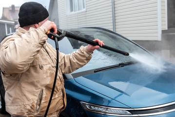 Process of car washing using high pressure water.