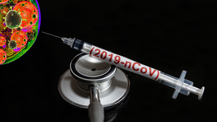Syringe have text "(2019-nCoV)" and stethoscope  put on  Black background. corona virus Concept.