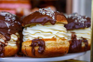 Scottish cream choux buns with chocolate close up