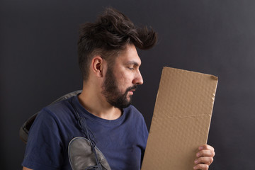 homeless tramp with a sign