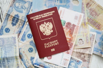 the foreign passport of the Russian Federation is placed on Vietnamese banknotes and rubles