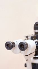 ophthalmologist doctor in exam optician laboratory with female patient. Eye care medical diagnostic. Eyelid treatment