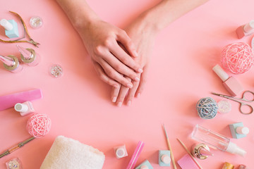 flat picture of hands in a beauty salon surrounded by accessories