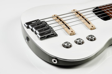 White bass guitar details on a white background with copy space