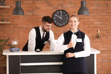 Male and female receptionists in hotel