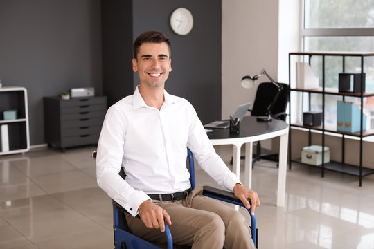 Handicapped young man in office