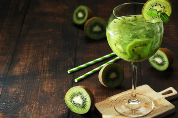 A glass with kiwi cocktail	