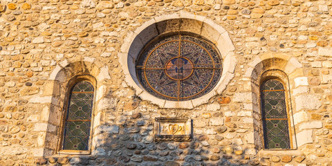 Stained window of Eglise Sainte-Marie church in the village of Vogüé in Ardeche, France