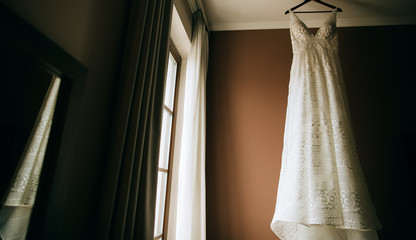 beautiful retro wedding bride dress in interior in hotel 