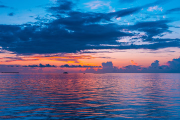 Beautiful Sunset Scenery over the Sea amazing Maldives nature background, amazing multi color cloudy sky with calm sea, Nature landscape background