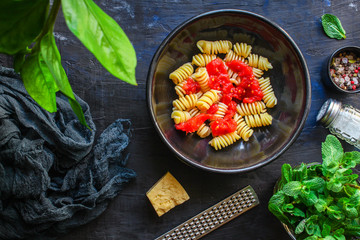 pasta rotini tomato sauce (vegetarian dish, Italian cuisine) menu concept. background. top view. copy space