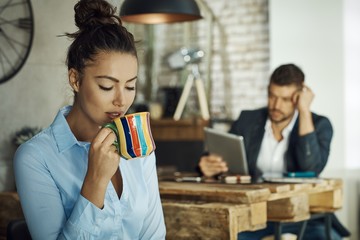 Young businesswoman enjoying tea