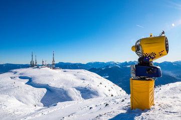 Transmission towers with snow cannons in the mountains. Alps - Dolomites