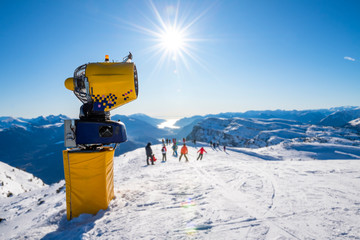 Snowmaker on the ski slopes of the Alps
