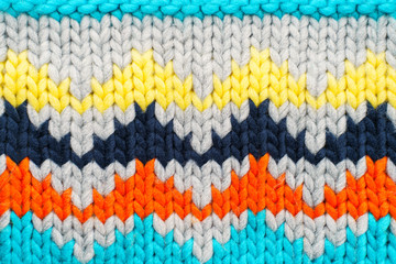 Handmade knitted multi-colored pattern. Hobby background