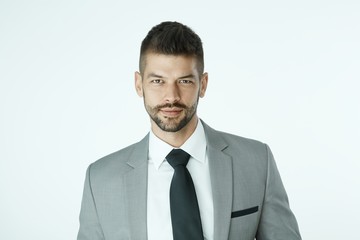 Portrait of businessman against white background