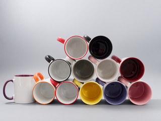 colored cups for sublimation in composition on a gray background - 319737814