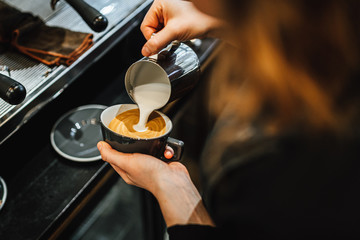 View on barista making coffee in coffee shop