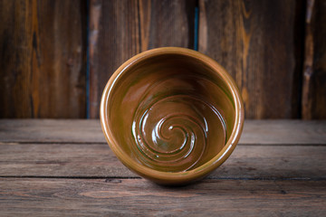 empty decorative bowl for shaving foam on wooden table, close view, barbershop concept