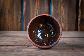 empty decorative bowl for shaving foam on wooden table, close view, barbershop concept 