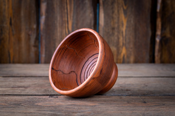 bowl for shaving foam on wooden table, close view, barbershop concept 