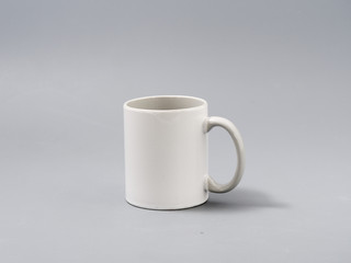 colored cups for sublimation in composition on a gray background