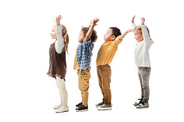 Fototapeta premium cute multiethnic children playing with hands up isolated on white